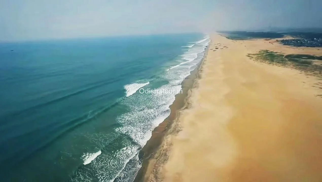 Beautiful view of Paradip Beach with serene waters and golden sands.