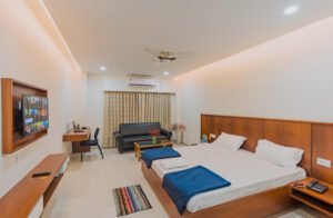 Spacious and well-furnished hotel room in Kendrapara with a cozy bed, modern amenities, and elegant decor.