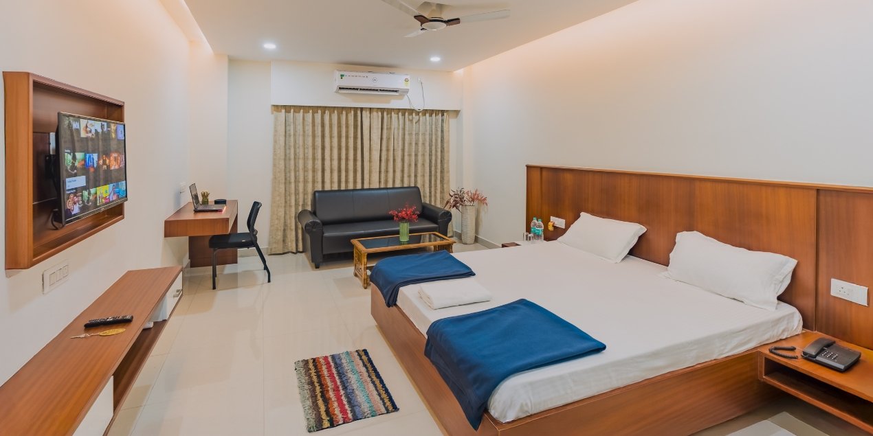 Softly lit hotel room with warm tones and cosy furnishings creating a relaxing ambience
